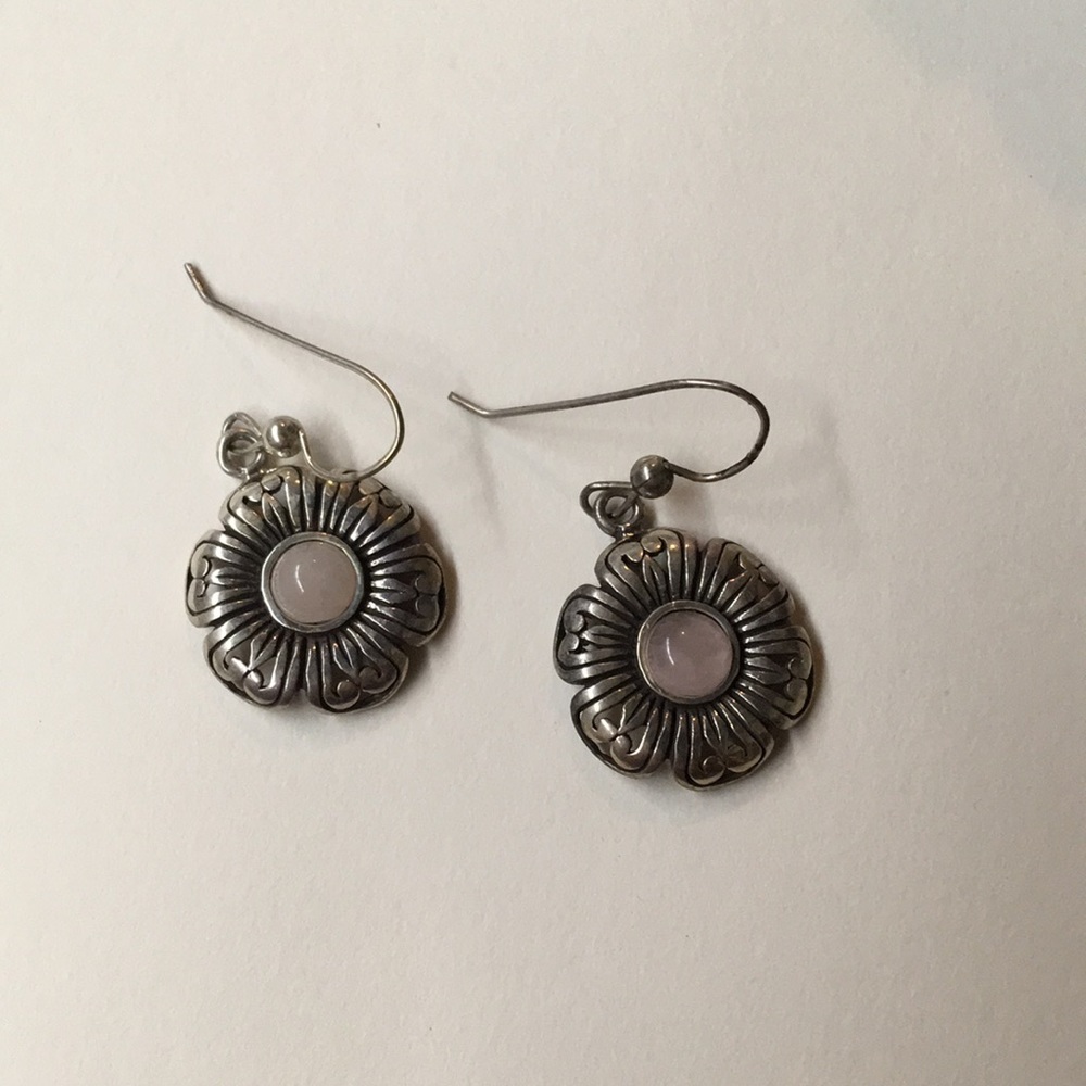 Dangling flower earrings with pink centers.